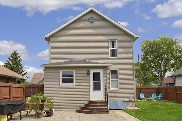 1107 W Lafayette St, Ottawa, IL 61350 - rear view of property featuring entry steps, an outdoor fire pit, a fenced backyard, and a patio