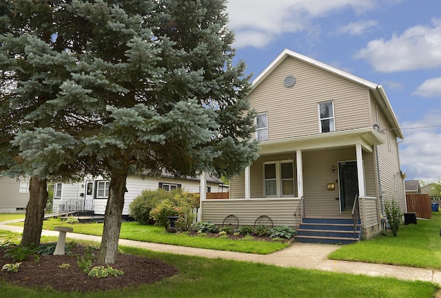 1107 W Lafayette St, Ottawa, IL 61350 - view of front facade featuring covered porch and a front lawn