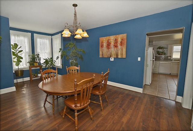 1107 W Lafayette St, Ottawa, IL 61350 - dining room featuring a chandelier, healthy amount of natural light, and wood finished floors