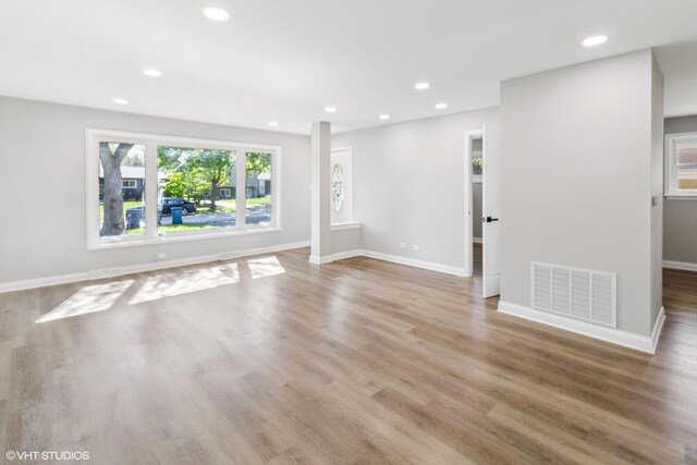524 Willow St, Itasca, IL 60143 - unfurnished living room featuring healthy amount of natural light, recessed lighting, and wood finished floors