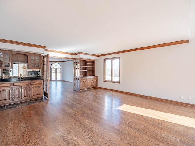 501 Bryan Trl, New Lenox, IL 60451 - unfurnished living room featuring ornamental molding, plenty of natural light, and dark wood-style floors