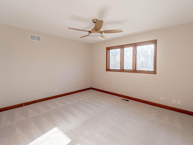 501 Bryan Trl, New Lenox, IL 60451 - spare room featuring a ceiling fan and light carpet