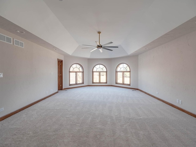 501 Bryan Trl, New Lenox, IL 60451 - carpeted spare room featuring a tray ceiling and a ceiling fan