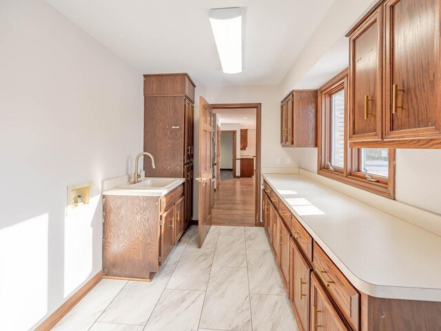 501 Bryan Trl, New Lenox, IL 60451 - kitchen with brown cabinetry, light countertops, and light marble finish flooring