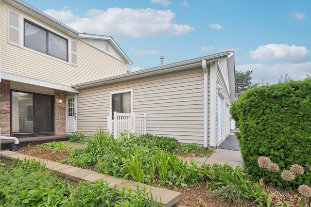 12 N Waterford Dr Unit 0, Schaumburg, IL 60194 - view of home's exterior featuring brick siding