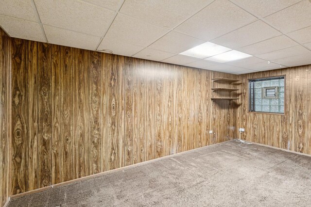 12 N Waterford Dr Unit 0, Schaumburg, IL 60194 - unfurnished room featuring wooden walls, carpet, and a drop ceiling