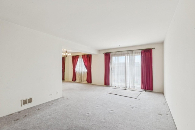 12 N Waterford Dr Unit 0, Schaumburg, IL 60194 - spare room featuring a chandelier and carpet floors