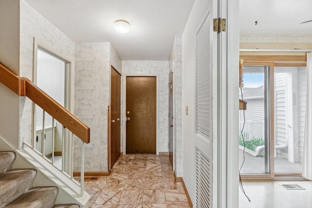 12 N Waterford Dr Unit 0, Schaumburg, IL 60194 - hall with stairway and wallpapered walls