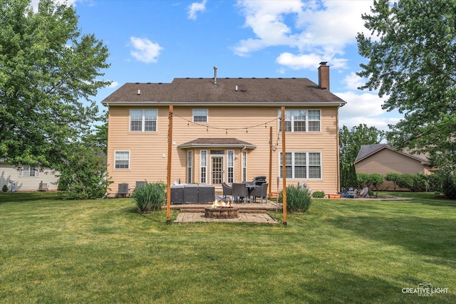 16260 W Mohawk Ct, Lockport, IL 60441 - back of property with a patio, a chimney, a fire pit, and a lawn