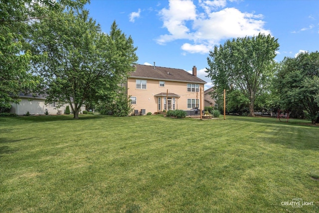 16260 W Mohawk Ct, Lockport, IL 60441 - rear view of property featuring a yard and a chimney