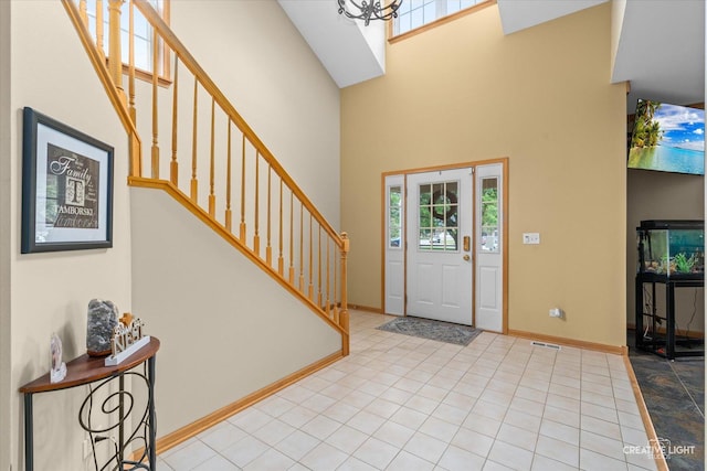 16260 W Mohawk Ct, Lockport, IL 60441 - entryway featuring a high ceiling, stairs, and a chandelier