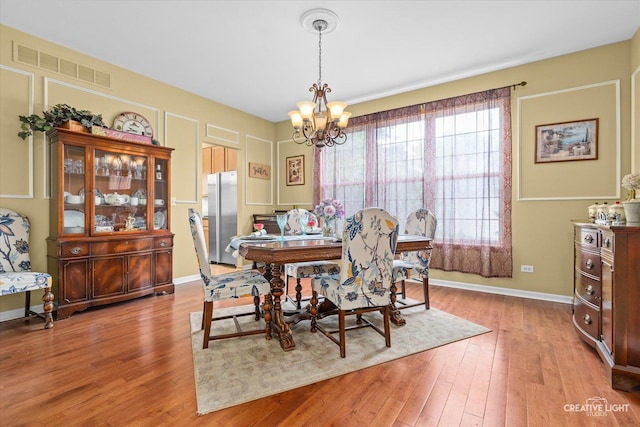16260 W Mohawk Ct, Lockport, IL 60441 - dining area featuring a chandelier and wood finished floors