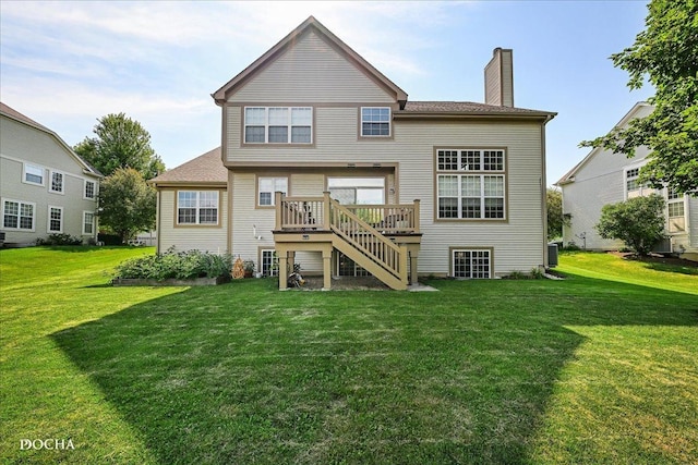 13311 Morning Mist Pl, Plainfield, IL 60585 - rear view of house with a chimney, a yard, a wooden deck, and stairway