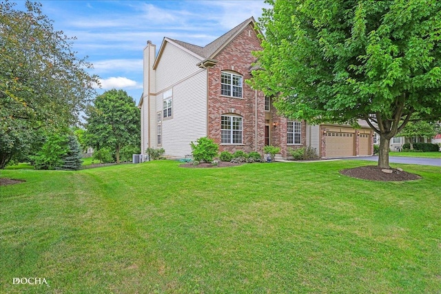13311 Morning Mist Pl, Plainfield, IL 60585 - view of front of home with driveway, brick siding, a chimney, and a front yard