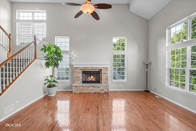 13311 Morning Mist Pl, Plainfield, IL 60585 - unfurnished living room with high vaulted ceiling, a ceiling fan, hardwood / wood-style flooring, and healthy amount of natural light