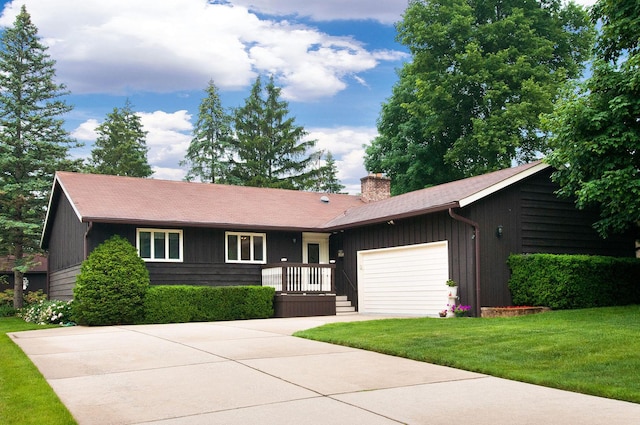 440 E Walnut St, Roselle, IL 60172 - single story home with a garage, a front lawn, a chimney, and driveway