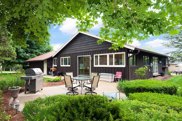 440 E Walnut St, Roselle, IL 60172 - back of property with board and batten siding and a patio
