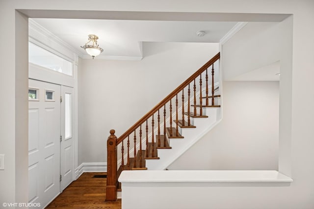 4848 N Seeley Ave, Chicago, IL 60625 - foyer entrance with crown molding, stairs, and wood finished floors