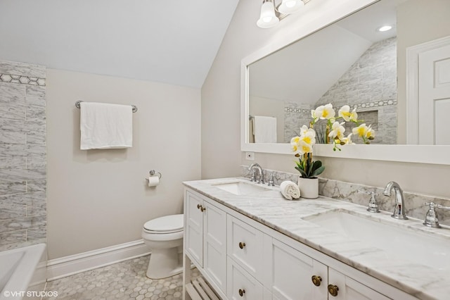4848 N Seeley Ave, Chicago, IL 60625 - full bathroom featuring vaulted ceiling, double vanity, and tile patterned floors