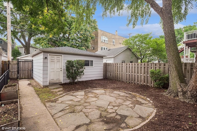 4848 N Seeley Ave, Chicago, IL 60625 - fenced backyard with a patio, an outbuilding, and a vegetable garden