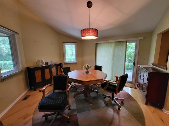 63 Lakewood Cir Unit 63, Saint Charles, IL 60174 - dining room featuring light wood finished floors and lofted ceiling
