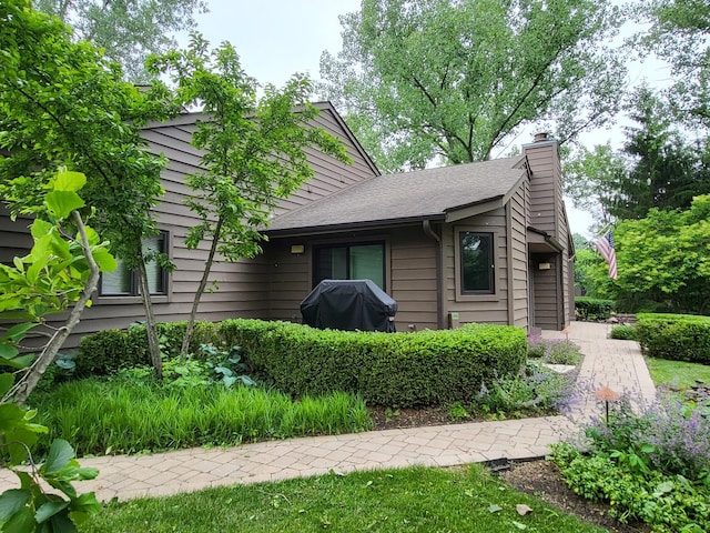 63 Lakewood Cir Unit 63, Saint Charles, IL 60174 - view of front of property with a chimney and a shingled roof