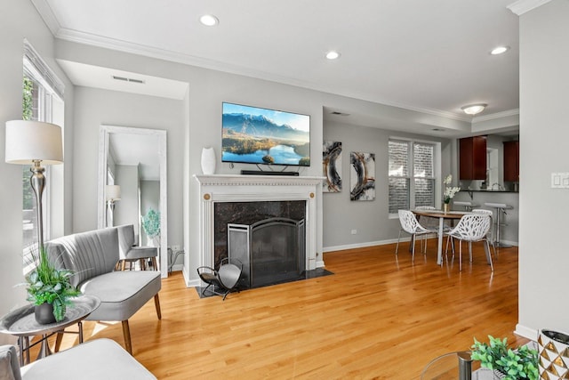 3522 N Fremont St Unit 2, Chicago, IL 60657 - living room with ornamental molding, light wood-style floors, recessed lighting, and a premium fireplace