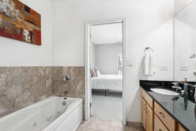3522 N Fremont St Unit 2, Chicago, IL 60657 - full bath with ensuite bathroom, vanity, a whirlpool tub, and marble look tile flooring