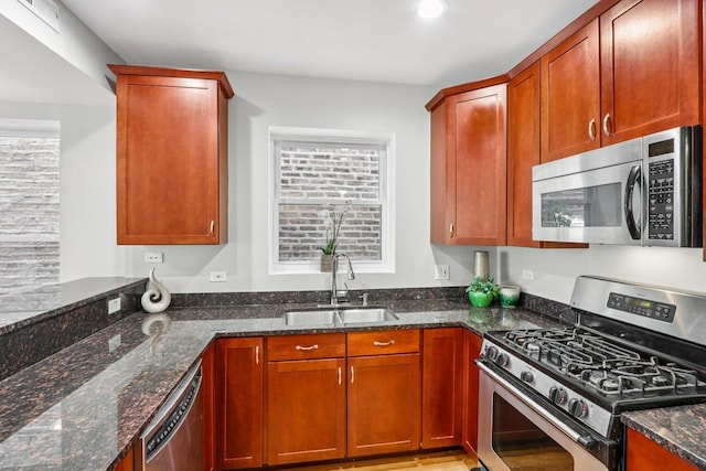 3522 N Fremont St Unit 2, Chicago, IL 60657 - kitchen with appliances with stainless steel finishes and dark stone countertops
