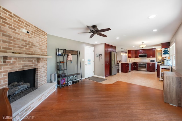 106 Grand Central Ln, Schaumburg, IL 60193 - living area with ceiling fan, light wood-style floors, recessed lighting, and a fireplace