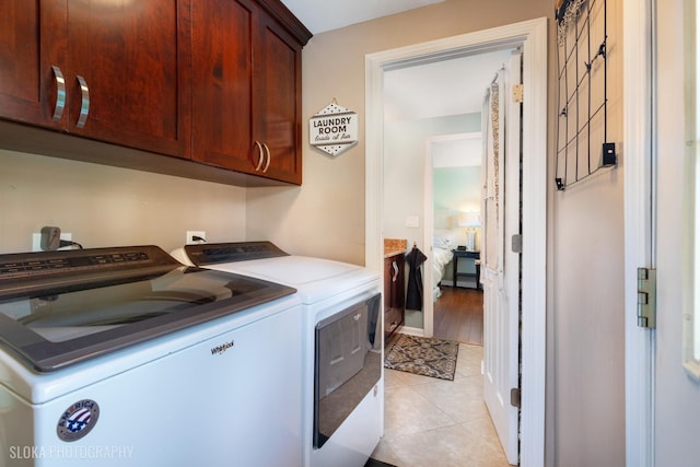 106 Grand Central Ln, Schaumburg, IL 60193 - washroom with cabinet space, washing machine and dryer, and light tile patterned floors