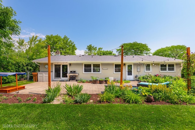 106 Grand Central Ln, Schaumburg, IL 60193 - rear view of property featuring a patio and a yard