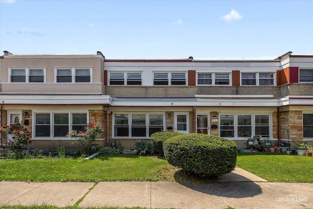 8933 N Washington St Unit D, Niles, IL 60714 - view of property featuring a front yard and stone siding