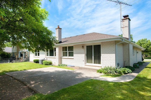 2811 N Harvard Ave, Arlington Heights, IL 60004 - rear view of property featuring a chimney, brick siding, and a patio area
