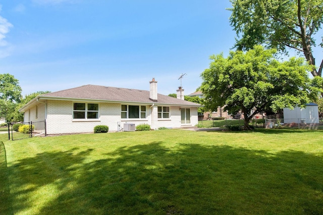 2811 N Harvard Ave, Arlington Heights, IL 60004 - back of house featuring a chimney and brick siding