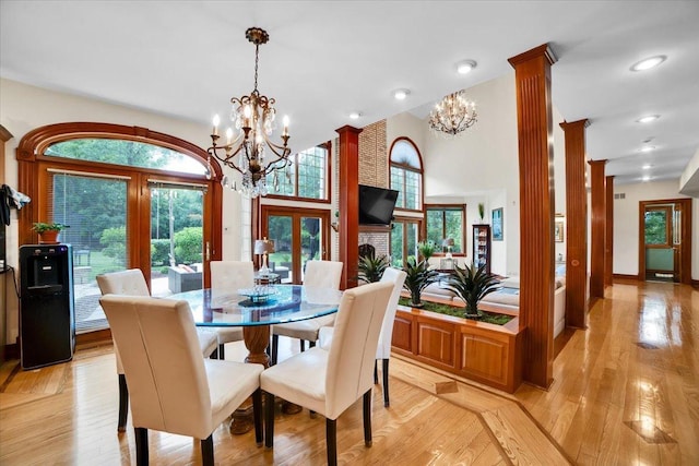 14695 Fox Hollow Ln, Lemont, IL 60439 - dining area with french doors, a chandelier, light wood-style flooring, recessed lighting, and decorative columns