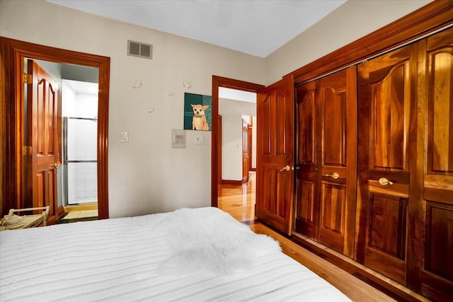 14695 Fox Hollow Ln, Lemont, IL 60439 - bedroom featuring wood finished floors and a closet