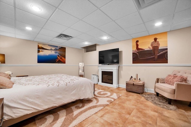 14695 Fox Hollow Ln, Lemont, IL 60439 - tiled bedroom with a drop ceiling, recessed lighting, and a glass covered fireplace