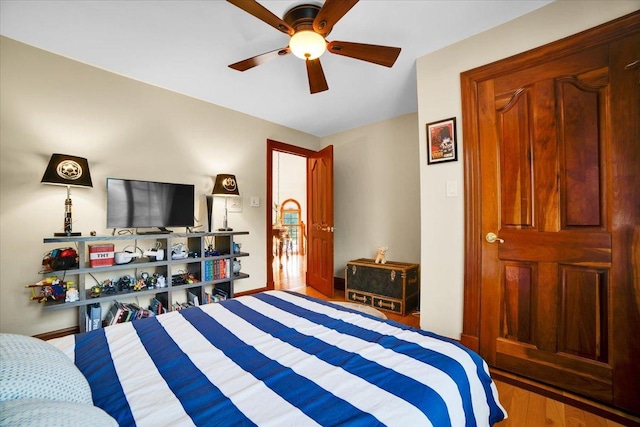 14695 Fox Hollow Ln, Lemont, IL 60439 - bedroom with wood finished floors and a ceiling fan