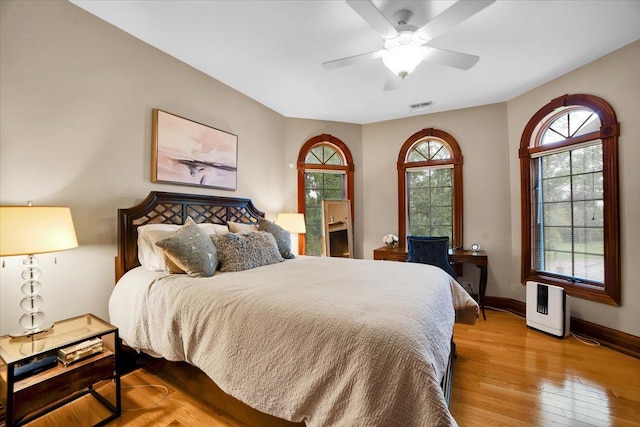 14695 Fox Hollow Ln, Lemont, IL 60439 - bedroom with wood finished floors and a ceiling fan