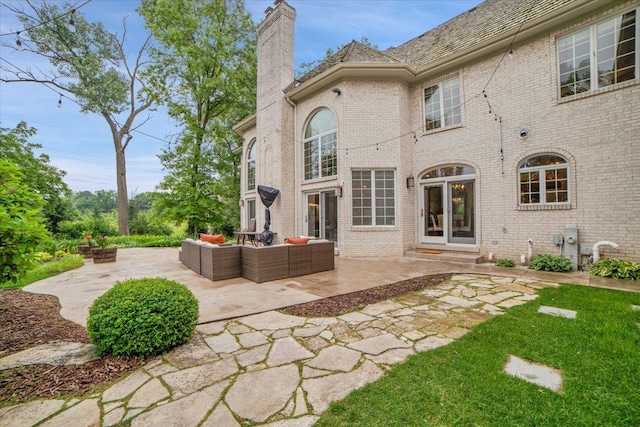 14695 Fox Hollow Ln, Lemont, IL 60439 - back of property featuring an outdoor living space, a chimney, a patio area, and brick siding
