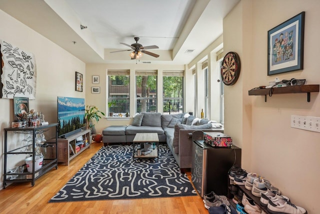 1159 N Hudson St Unit 1-101, Chicago, IL 60610 - living room with a raised ceiling, a ceiling fan, and wood finished floors