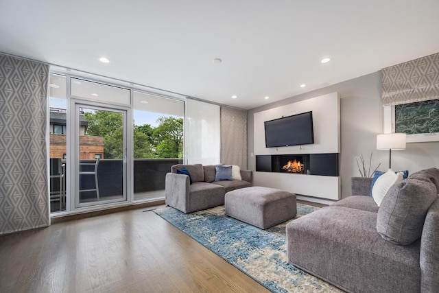 927 N Damen Ave Unit 2, Chicago, IL 60622 - living area with wood finished floors, a lit fireplace, and recessed lighting