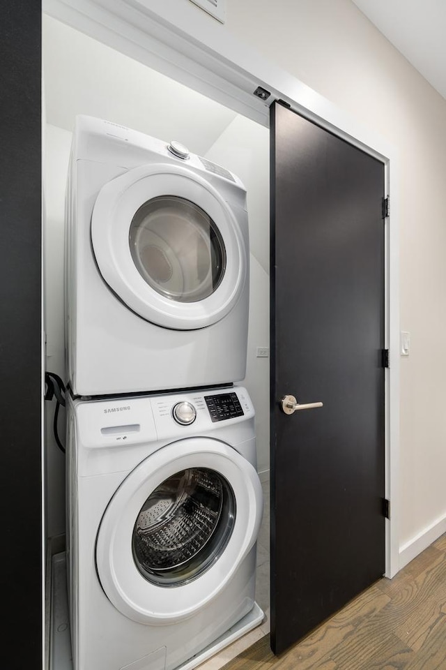 927 N Damen Ave Unit 2, Chicago, IL 60622 - laundry room featuring estacked washer and dryer and wood finished floors