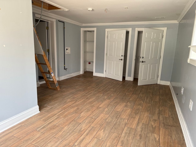 2705 W 98th St, Evergreen Park, IL 60805 - below grade area with wood finished floors and crown molding