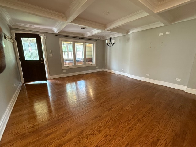 2705 W 98th St, Evergreen Park, IL 60805 - unfurnished room featuring a chandelier, coffered ceiling, beamed ceiling, dark wood-type flooring, and crown molding