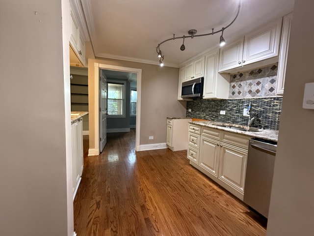 2705 W 98th St, Evergreen Park, IL 60805 - kitchen featuring stainless steel appliances, ornamental molding, tasteful backsplash, white cabinetry, and dark wood-type flooring