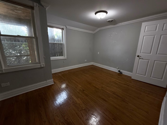 2705 W 98th St, Evergreen Park, IL 60805 - empty room with wood finished floors and ornamental molding