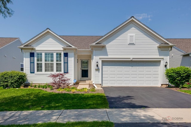 3181 Rockwell Cir, Mundelein, IL 60060 - ranch-style home with driveway, an attached garage, and a front lawn