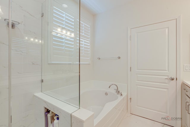 3181 Rockwell Cir, Mundelein, IL 60060 - bathroom with vanity, a garden tub, and a marble finish shower